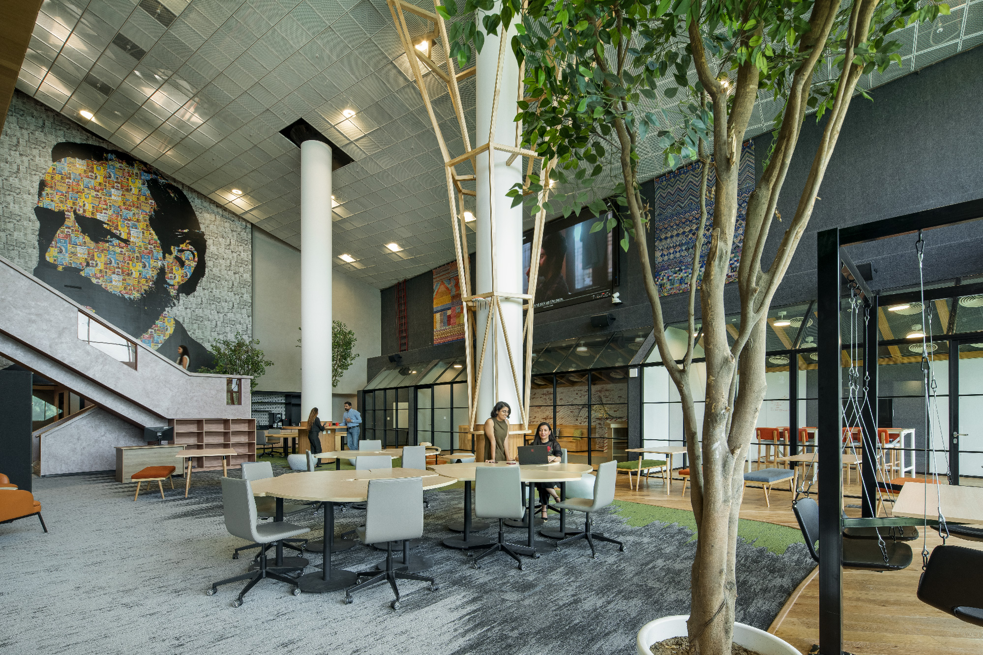benefits of workplace design with natural elements and ample sunlight.