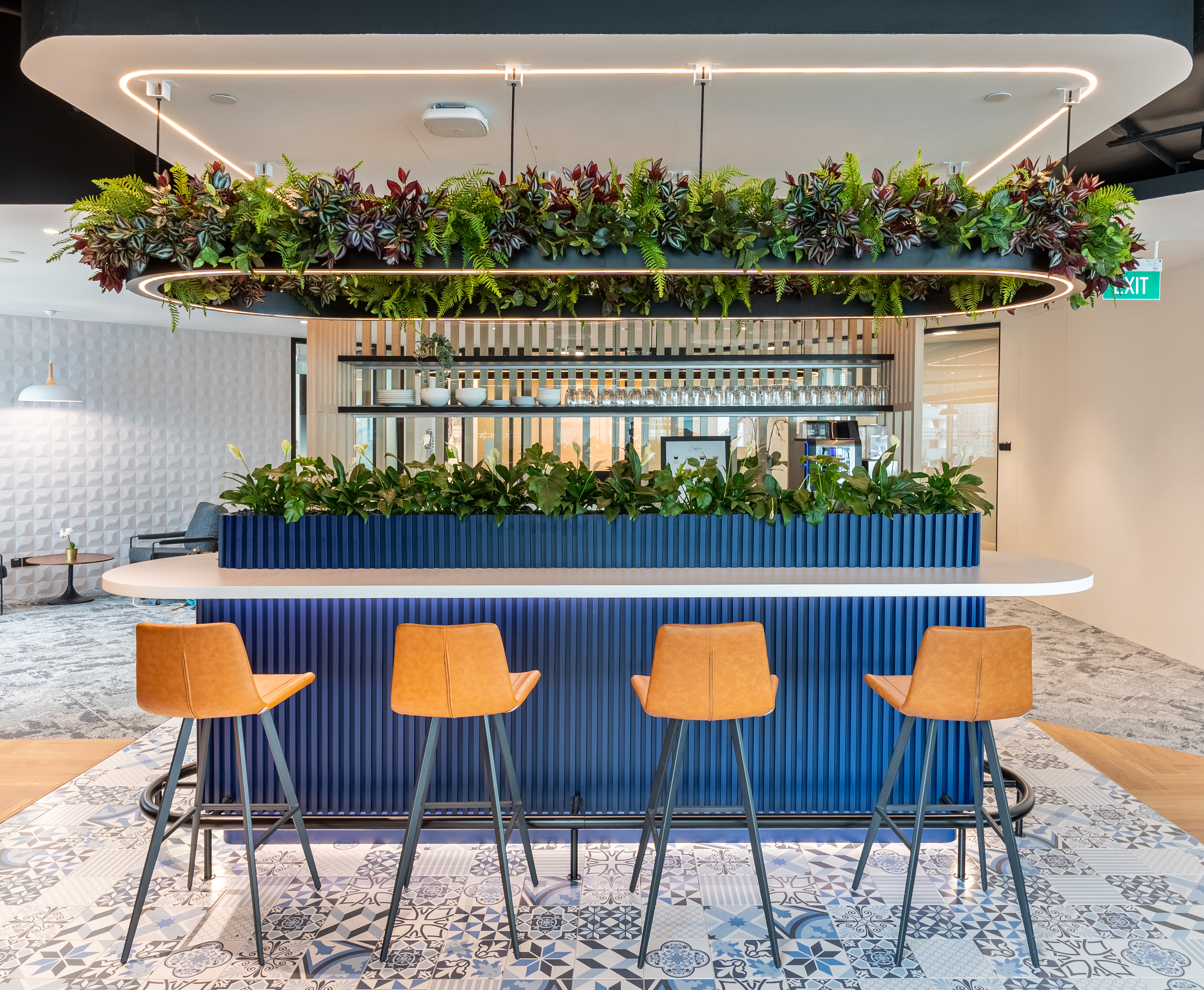 Space Matrix designed a chic pantry that mirrors the buzzing vibe of a coworking space